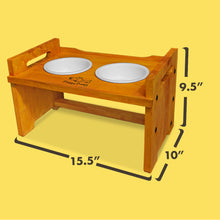 Load image into Gallery viewer, Elevated Wooden Dog Bowl Stand with 2 Ceramic Bowls. Raised Pet Feeder Stand for Small and Medium-Sized Dogs. Measures 15.50 Inches Wide by 9.50 Inches High. Feed Your Dog in Style.
