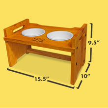 Load image into Gallery viewer, Elevated Wooden Dog Bowl Stand with 2 Ceramic Bowls. Raised Pet Feeder Stand for Small and Medium-Sized Dogs. Measures 15.50 Inches Wide by 9.50 Inches High. Feed Your Dog in Style.