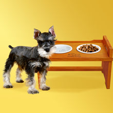 Load image into Gallery viewer, Elevated Wooden Dog Bowl Stand with 2 Ceramic Bowls. Raised Pet Feeder Stand for Small and Medium-Sized Dogs. Measures 15.50 Inches Wide by 9.50 Inches High. Feed Your Dog in Style.