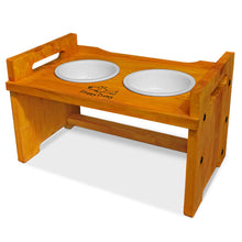 Load image into Gallery viewer, Elevated Wooden Dog Bowl Stand with 2 Ceramic Bowls. Raised Pet Feeder Stand for Small and Medium-Sized Dogs. Measures 15.50 Inches Wide by 9.50 Inches High. Feed Your Dog in Style.
