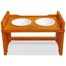 Load image into Gallery viewer, Elevated Wooden Dog Bowl Stand with 2 Ceramic Bowls. Raised Pet Feeder Stand for Small and Medium-Sized Dogs. Measures 15.50 Inches Wide by 9.50 Inches High. Feed Your Dog in Style.
